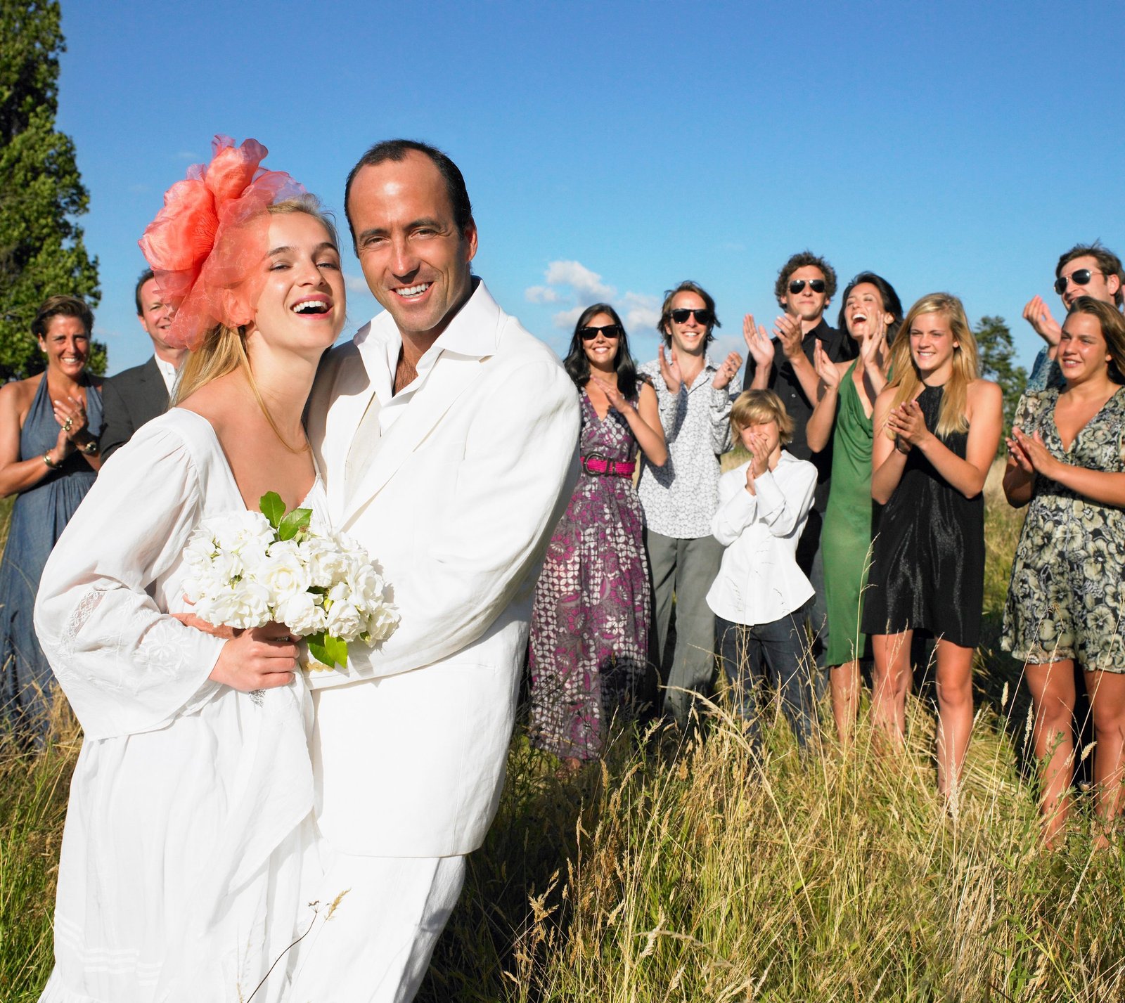 Married couple, group of people behind